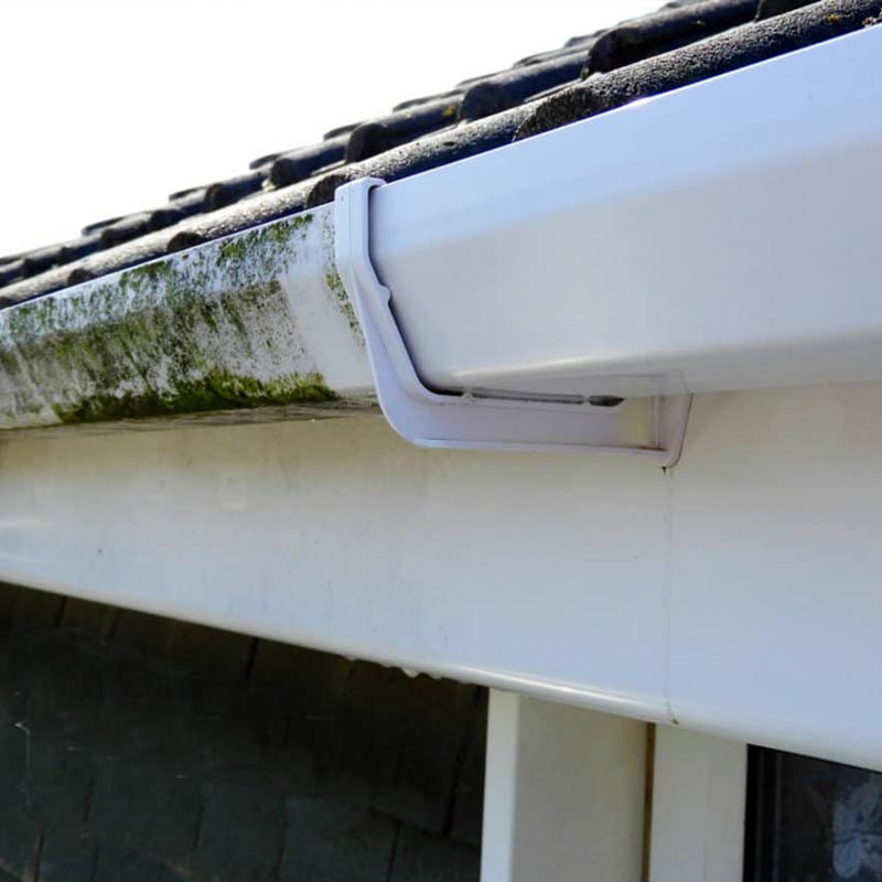 Fascia and soffit boards being washed back to a like-new white finish