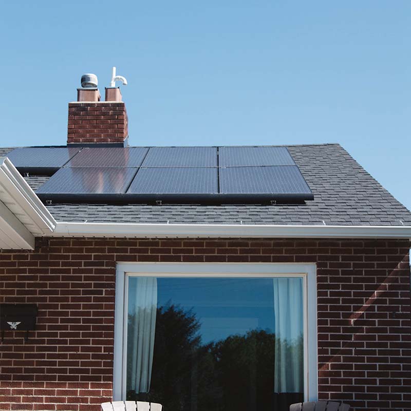 Solar panels on a roof being cleaned to improve efficiency